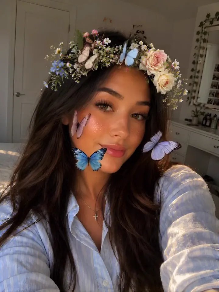 Face: a flower crown and butterflies over a selfie